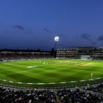 crowd of people sitting on stadium seats