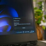 a laptop computer sitting on top of a table