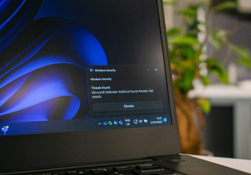 a laptop computer sitting on top of a table
