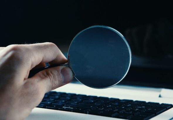 person holding round blue frame