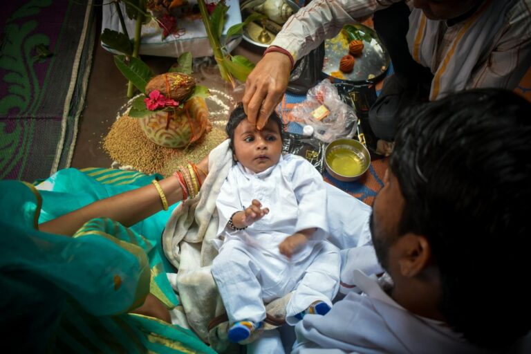 A cultural baby blessing ceremony with family, showcasing rich traditions and rituals.